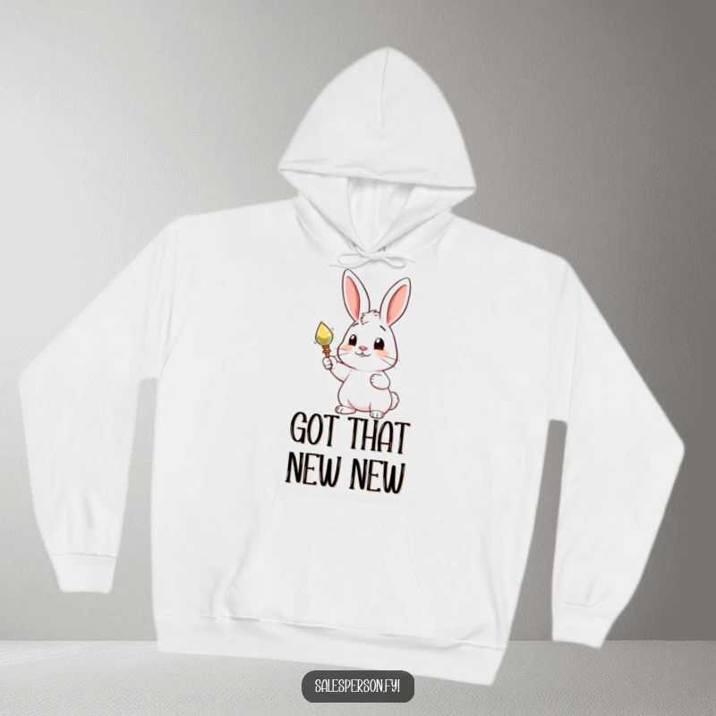 Funny hoodie featuring a curious rabbit proudly presenting a shiny object, offering cozy comfort and a sense of playful pride.