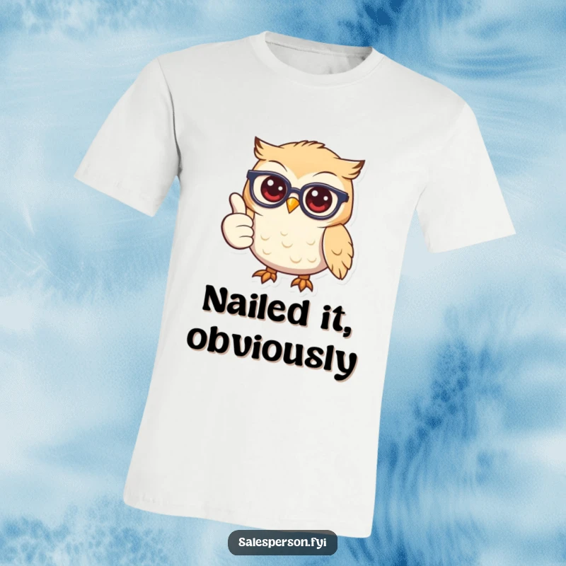 A wise and friendly owl wearing spectacles, giving a big thumbs up with a wide smile on a t-shirt.